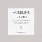 Wedding invitation card with 'Aureline Gavin' at top, rose illustration, and event details on a gray background