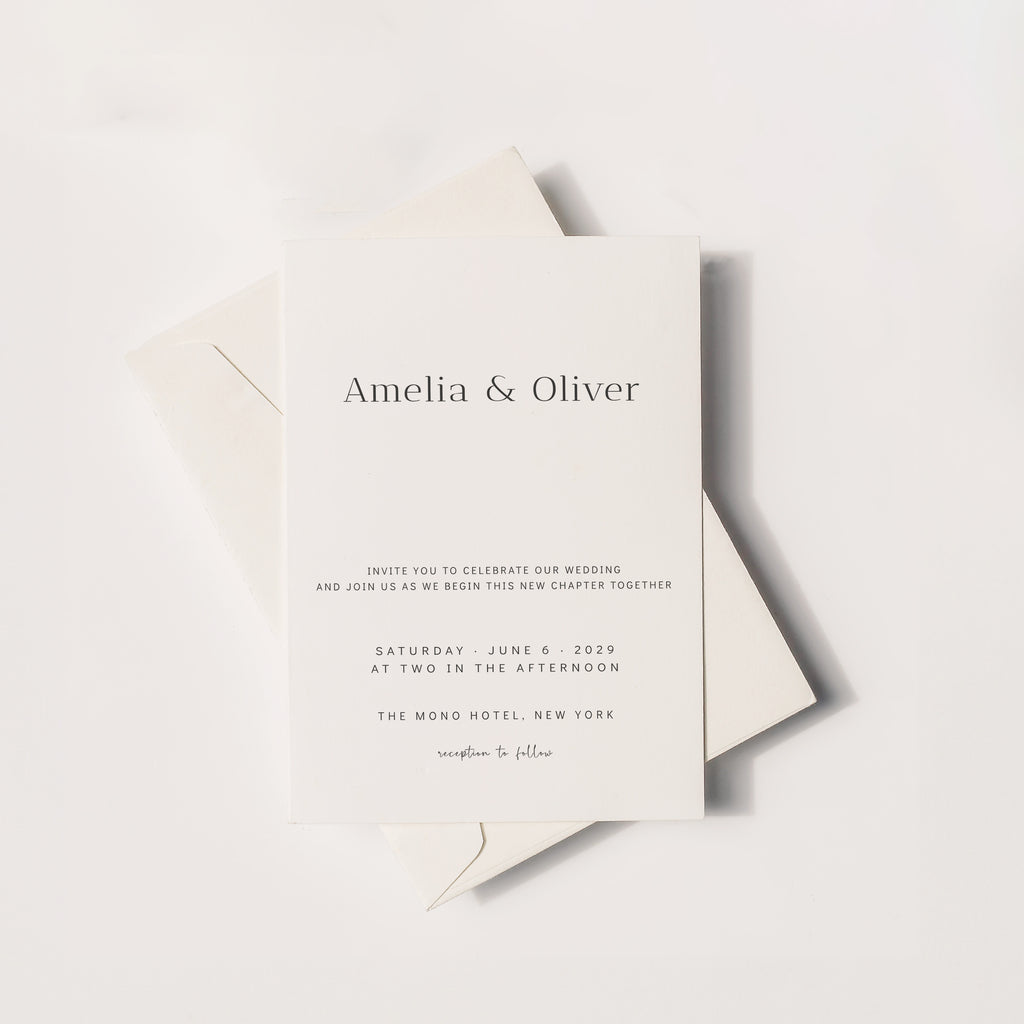 Minimalist wedding invitation mockup with envelope featuring elegant serif typography, neutral modern stationery design
