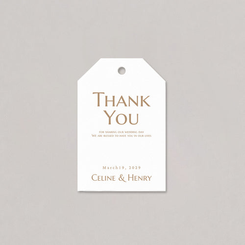 White tag with gold text 'Thank You' and personalized details on a gray background
