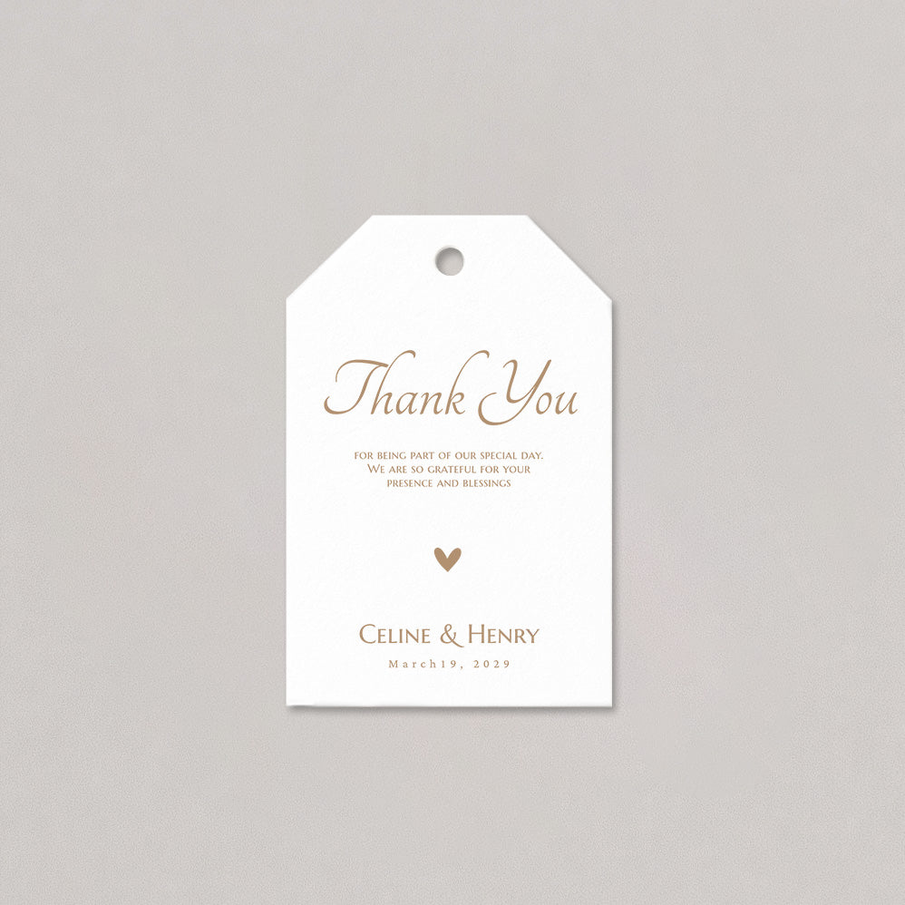 White tag with gold text 'Thank You' and personalized details on a gray background