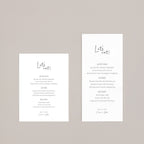 Two white menu cards with 'Let's eat!' text on a beige background