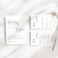 Minimal wedding invitation suite with RSVP and details card, clean modern typography, neutral paper textures, editorial flat lay wedding stationery