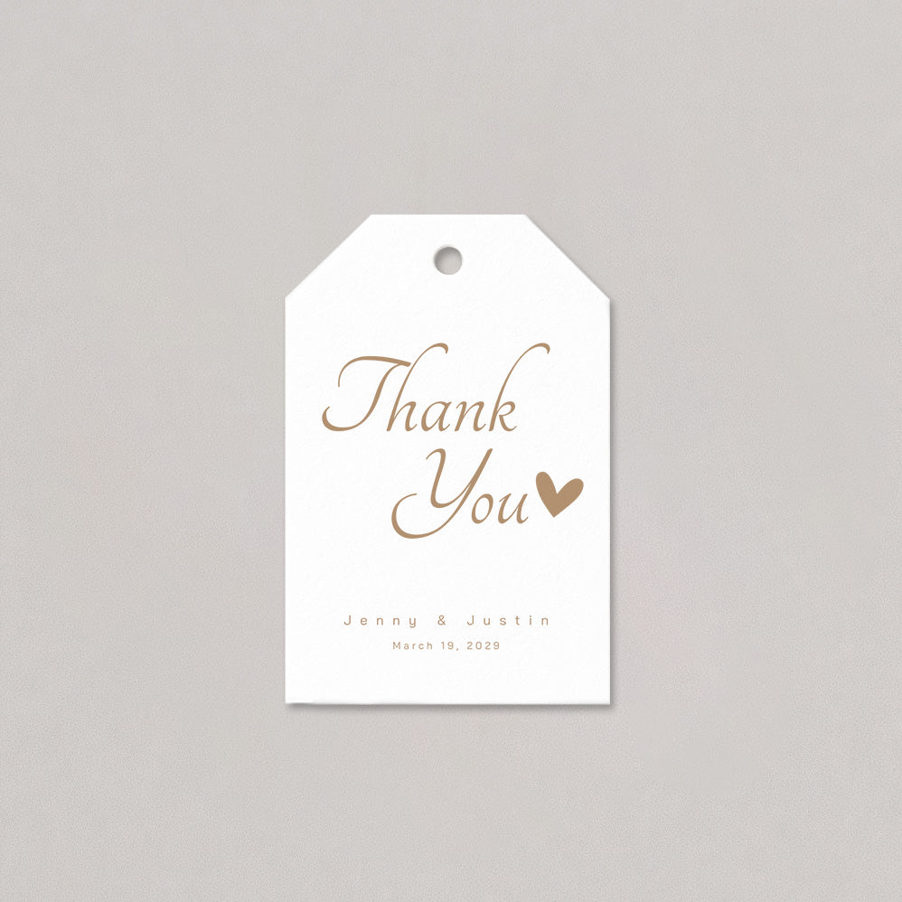 White tag with 'Thank You' and a heart in gold on a gray background