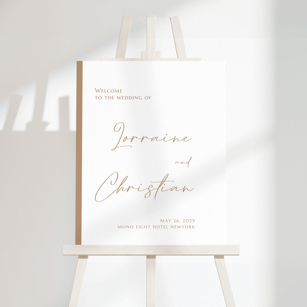 Minimal modern wedding welcome sign with warm script names and clean serif typography on a light neutral background