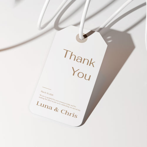 White tag with 'Thank You' and 'Luna & Chris' text on a white background