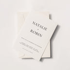 Minimal wedding invitation with bold serif typography and stacked name layout