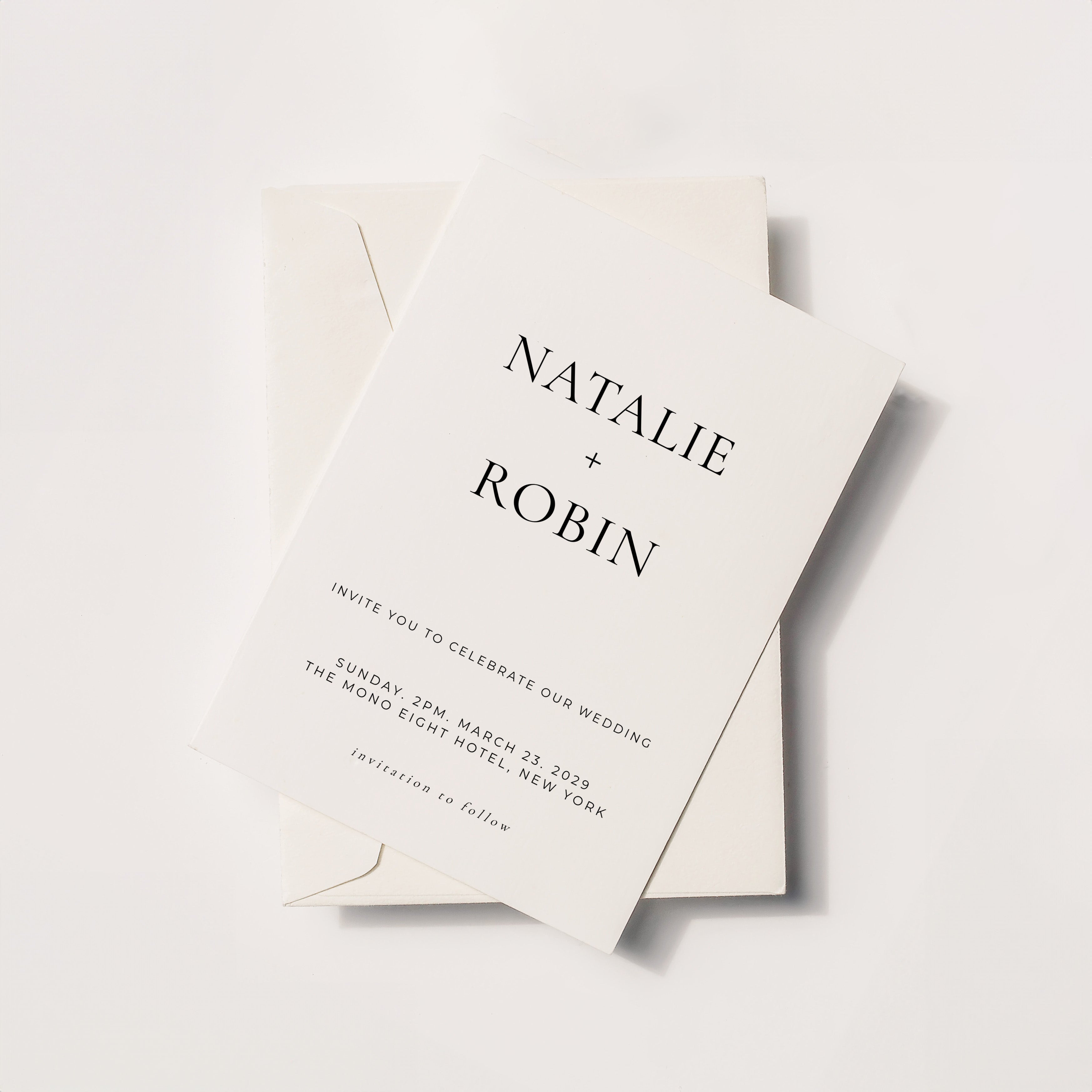 Minimal wedding invitation with bold serif typography and stacked name layout